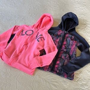 Pair of hooded, zip up jackets